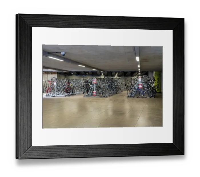 Framed Print : London, United Kingdom - 16 May 2025: Bicycle storage area near London Bridge showing rows of bikes and metal racks