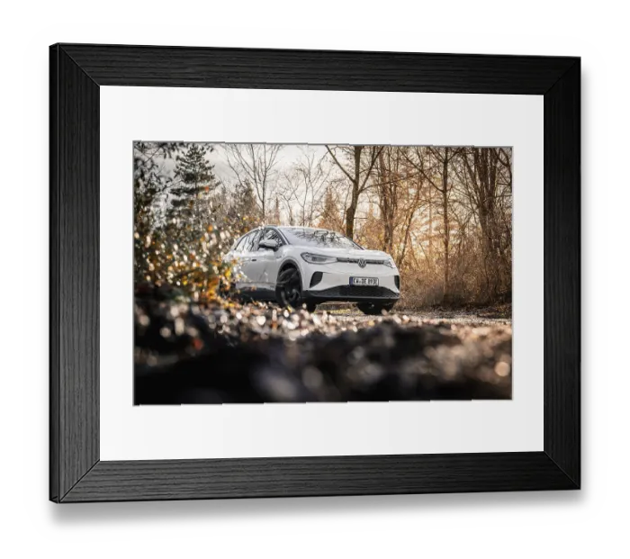 Framed Print : Car in an autumn forest landscape with bare trees