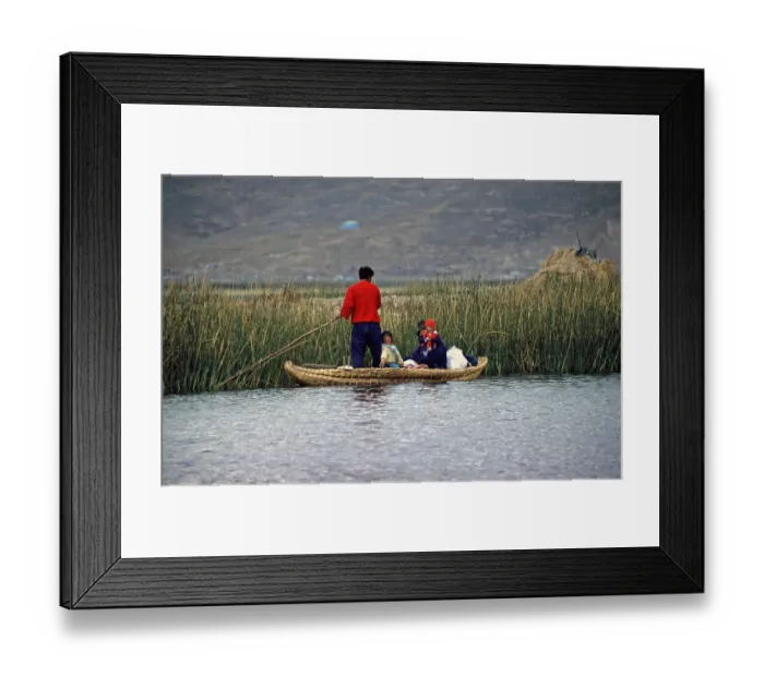Framed Print : Young family with young children in a reed boat