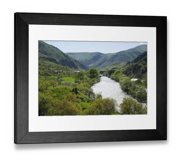 Framed Print : Idyllic valley with a flowing river