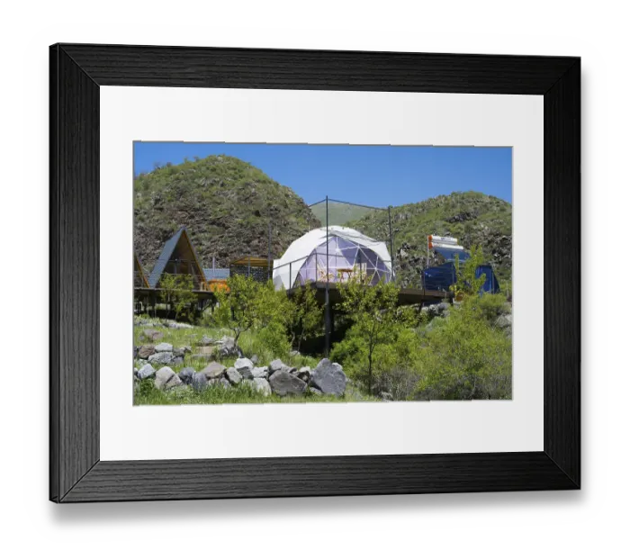 Framed Print : A modern dome tent in a mountainous landscape under blue sky Framed Print : A modern dome tent in a mountainous landscape under blue sky