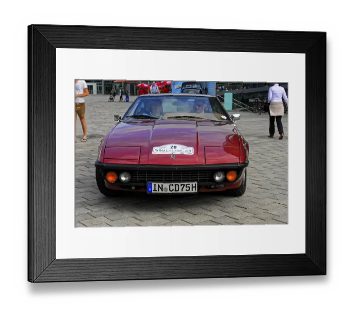Framed Print : Classic red car seen from the front at a classic car event on the road