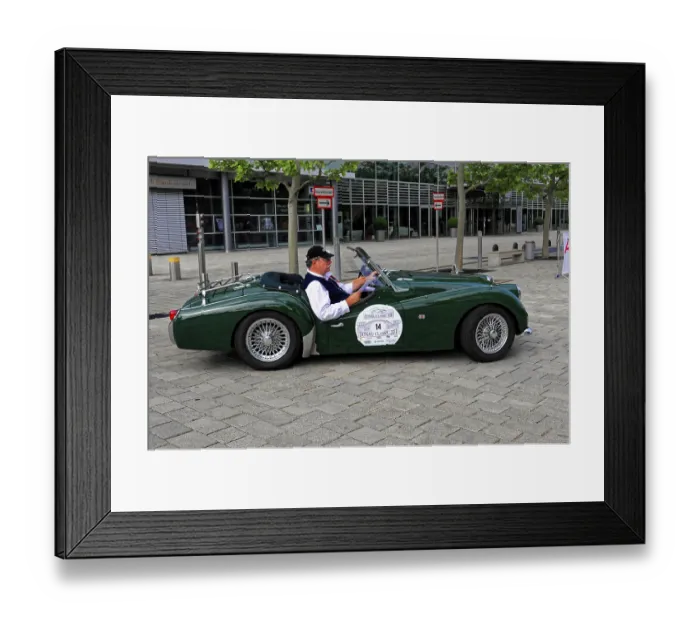 Framed Print : Green roadster with driver at a stylish classic car event on the road Framed Print : Green roadster with driver at a stylish classic car event on the road