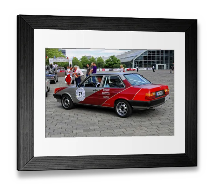 Framed Print : Rear view of a car with red accents at a lively classic car event