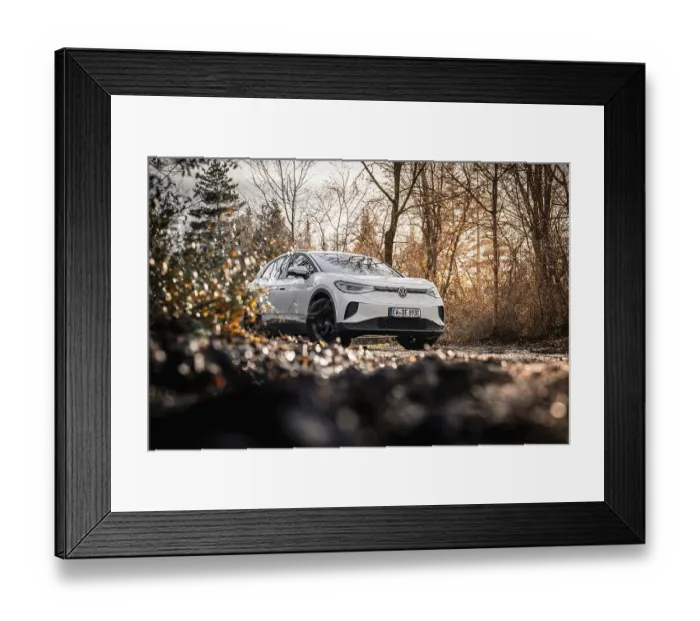 Framed Print : Car in an autumn forest landscape with bare trees