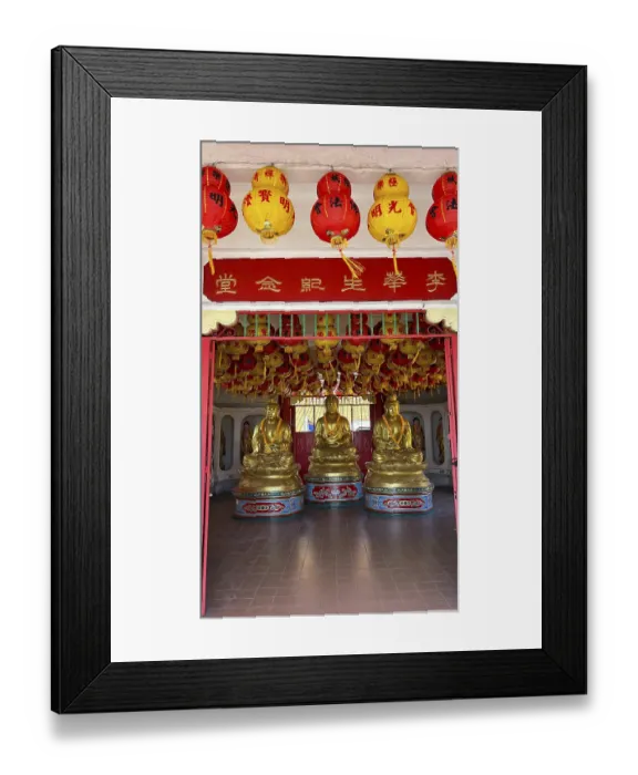 Framed Print : Three golden Buddha statues in the decorative interior of the temple Framed Print : Three golden Buddha statues in the decorative interior of the temple