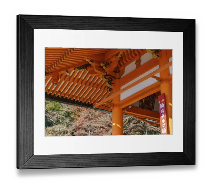 Framed Print : Detail of a Japanese temple with orange wood structures and autumn background