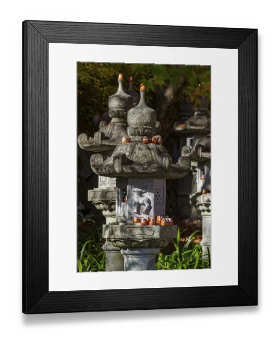 Framed Print : Stone lanterns with small figures in a Japanese garden