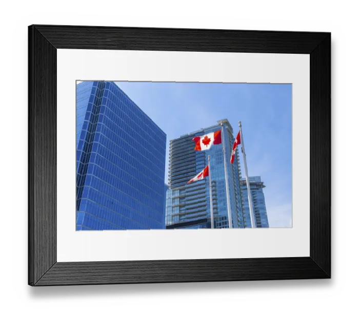 Framed Print : Three canadian flags are waving proudly against a backdrop of modern skyscrapers in downtown vancouver Framed Print : Three canadian flags are waving proudly against a backdrop of modern skyscrapers in downtown vancouver