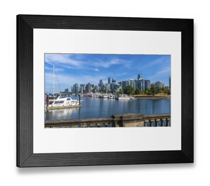 Framed Print : Luxury yachts and sailboats are moored in coal harbour marina