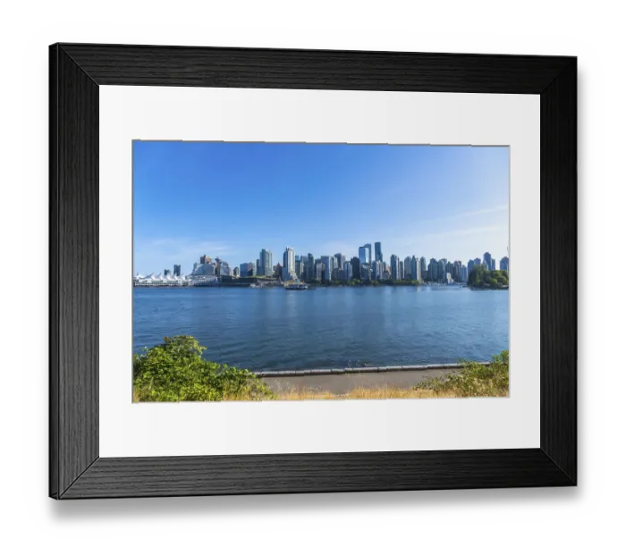 Framed Print : Panoramic view of vancouver's modern skyline rising above the calm pacific ocean on a sunny day Framed Print : Panoramic view of vancouver's modern skyline rising above the calm pacific ocean on a sunny day