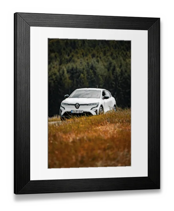 Framed Print : A white car drives through a beautiful meadow landscape surrounded by trees