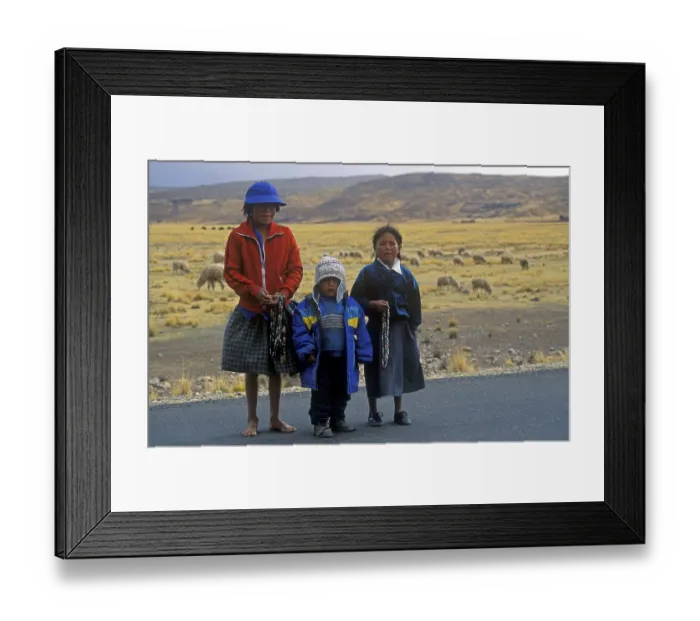 Framed Print : Children sell cheap jewelry on the roadside near Puno