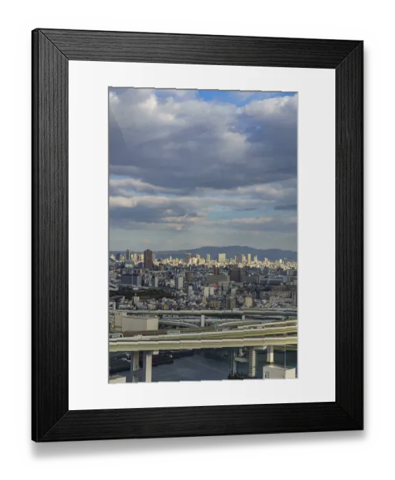 Framed Print : Urban panorama with visible highways and mountains on the horizon under a cloud cover