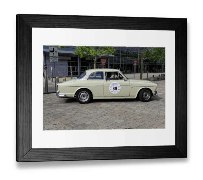 Framed Print : Vintage beige car in retro design at an urban rally event with trees