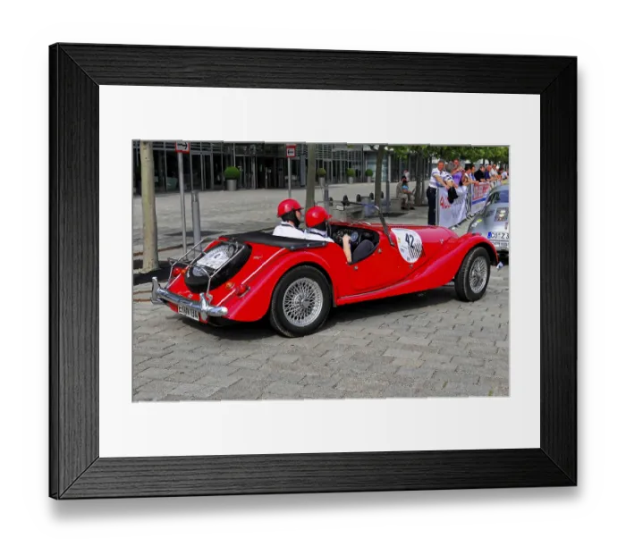 Framed Print : Morgan 4-4 Completition, red vintage convertible with helmet wearers in a city at a rally Framed Print : Morgan 4-4 Completition, red vintage convertible with helmet wearers in a city at a rally