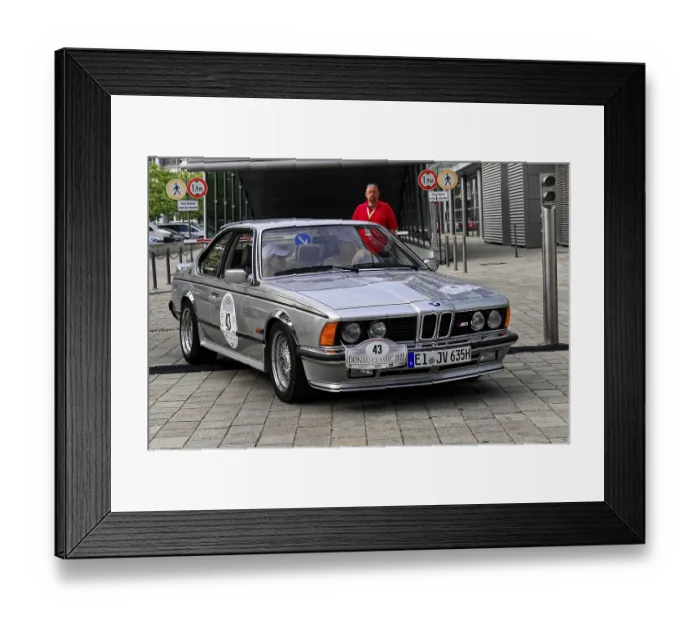 Framed Print : BMW 635 CSI, A silver BMW vintage sports car at an automotive event on a paved road Framed Print : BMW 635 CSI, A silver BMW vintage sports car at an automotive event on a paved road