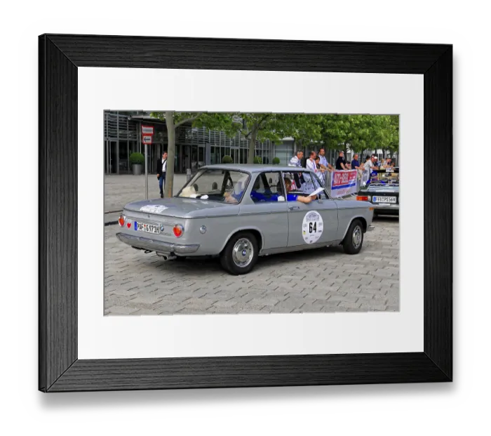 Framed Print : BMW, gray four-door classic car at a car event on cobblestones