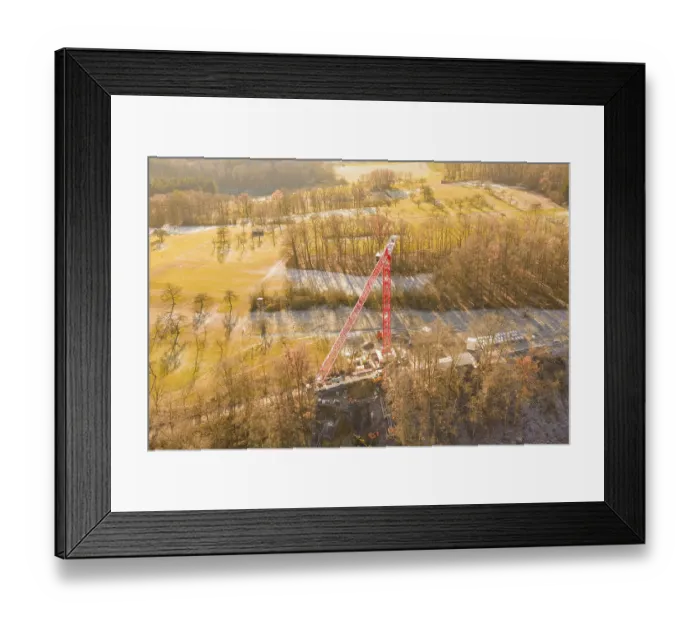 Framed Print : Crane dominates construction site in autumn landscape Framed Print : Crane dominates construction site in autumn landscape