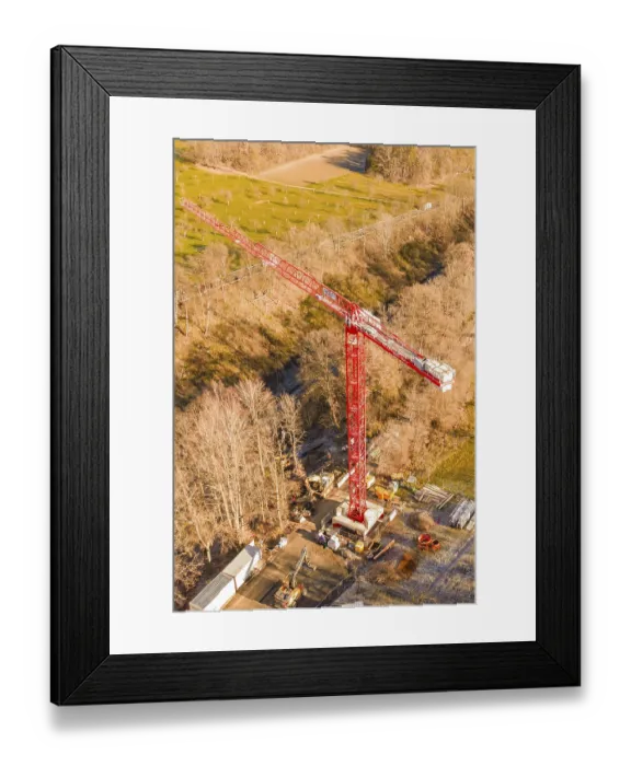 Framed Print : Red crane on a construction site