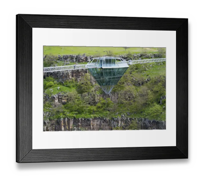 Framed Print : Modern glass bridge crosses green gorge with trees and rocks