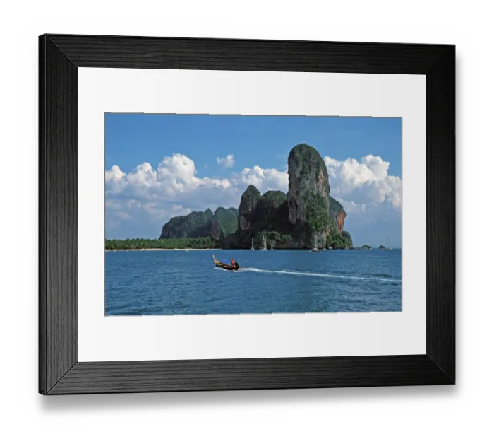 Framed Print : Longtail boat, rocks in the sea Framed Print : Longtail boat, rocks in the sea