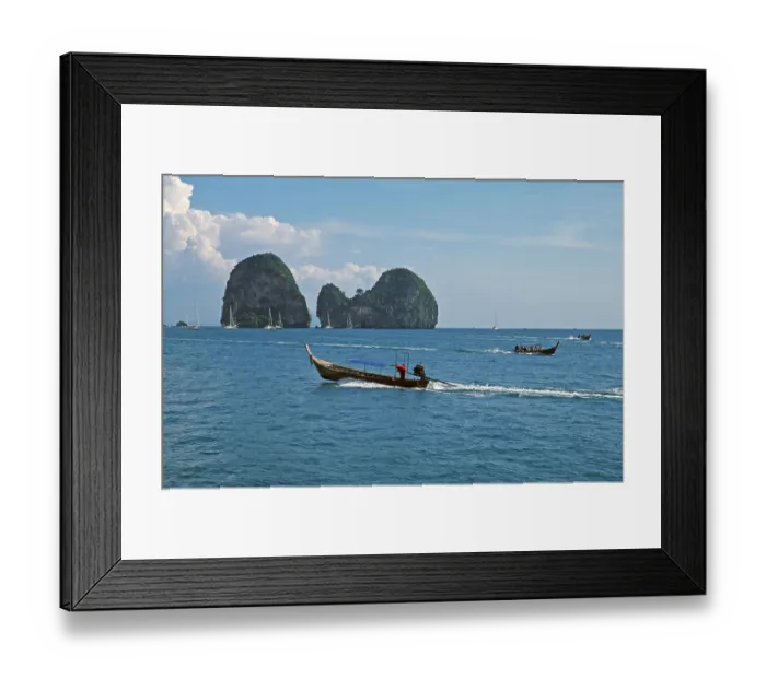 Framed Print : Longtail boats, rocks in the sea
