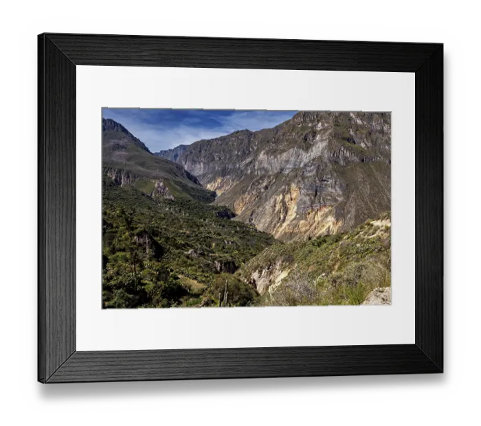 Framed Print : Deep valleys and rock walls full of dense vegetation under clear skies Framed Print : Deep valleys and rock walls full of dense vegetation under clear skies
