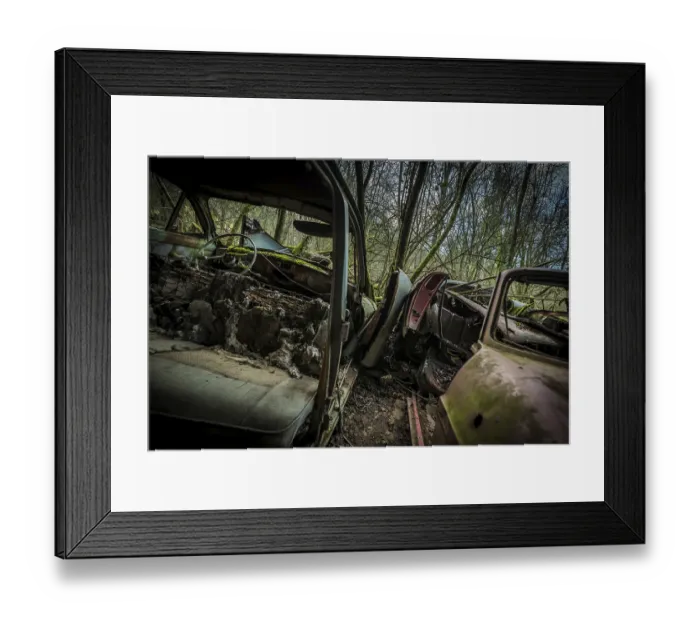 Framed Print : Moss-Covered Vintage Car Graveyard in Overgrown Forest - Rusted Interiors and Nature Reclaiming