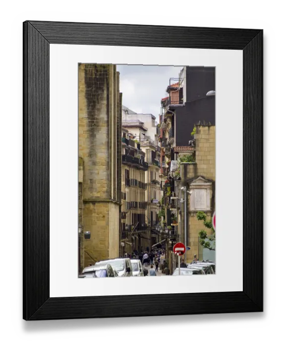 Framed Print : Narrow lively alley in a historic town with tall buildings Framed Print : Narrow lively alley in a historic town with tall buildings
