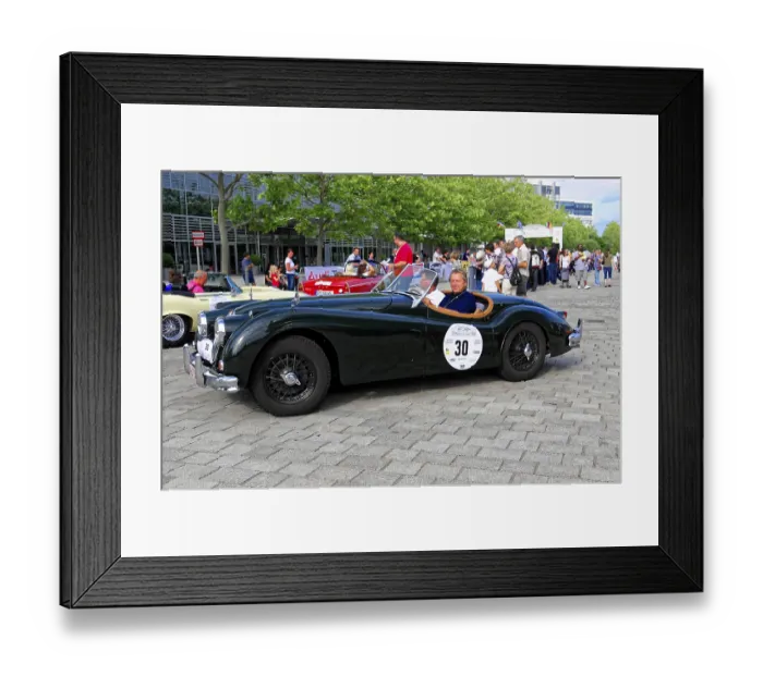 Framed Print : Jaguar XK 140, black convertible with smiling driver at an outdoor classic car event
