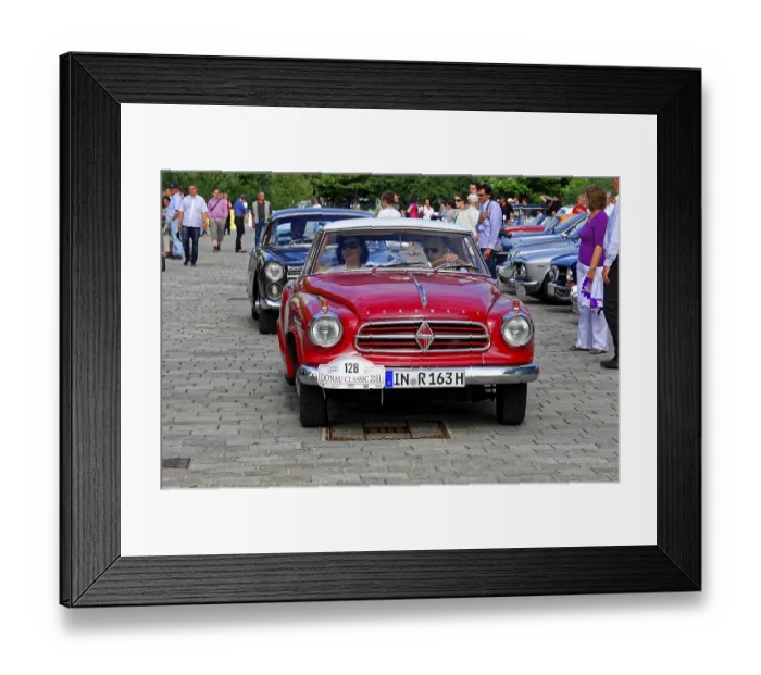 Framed Print : Red coupe vehicle at a vintage car event surrounded by people and other cars