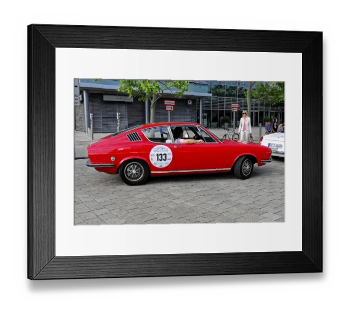 Framed Print : AUDI, A red classic car in profile stands on a cemented square surrounded by trees Framed Print : AUDI, A red classic car in profile stands on a cemented square surrounded by trees
