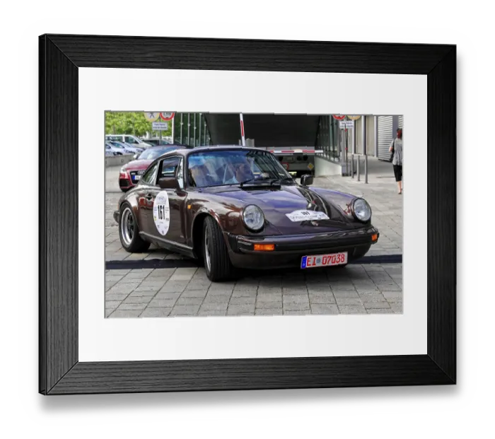 Framed Print : Vintage brown Porsche car at an automotive event in the city