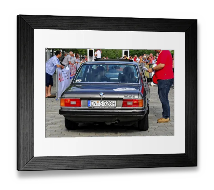Framed Print : Black BMW on a classic car rally surrounded by people and other cars