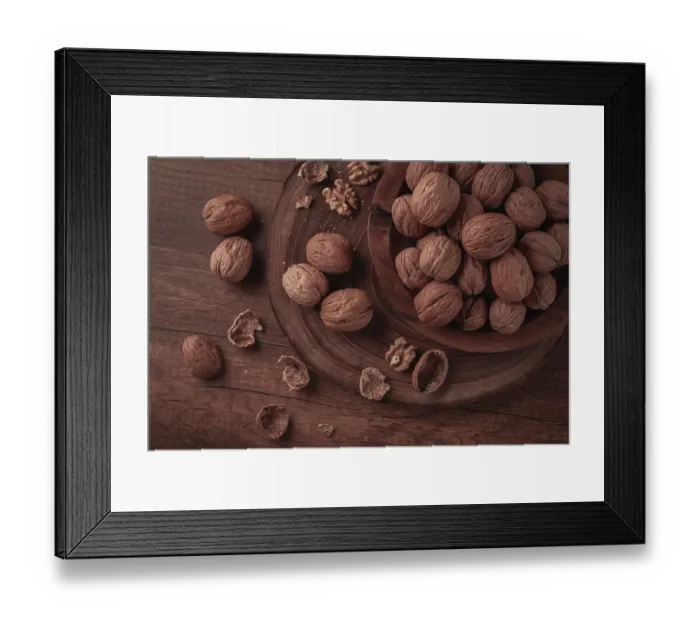 Framed Print : A wooden bowl holds many walnuts Framed Print : A wooden bowl holds many walnuts