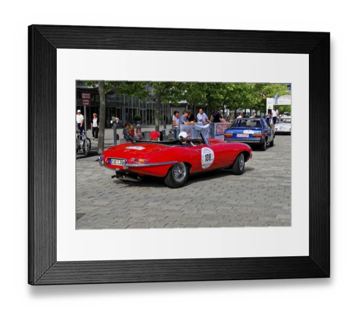 Framed Print : Jaguar E-Type S1, red vintage convertible seen from behind at an outdoor event