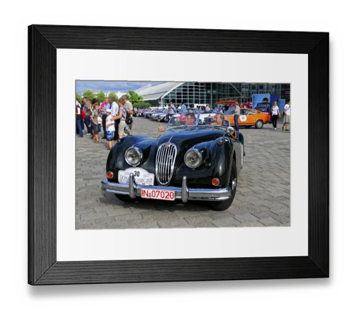 Framed Print : Jaguar XK 140, black convertible with two men at an open-air classic car event