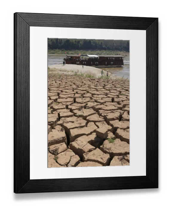 Framed Print : Parched, dry earth crust on the banks of the Mekong