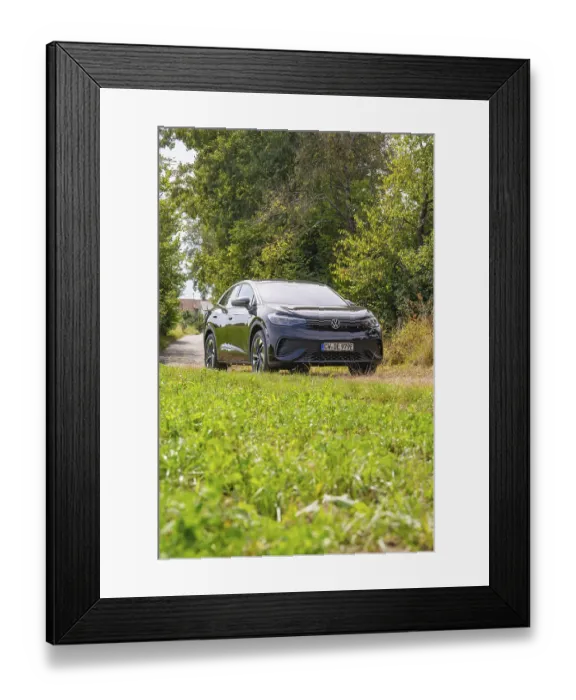 Framed Print : Black SUV on a green forest path surrounded by nature and trees