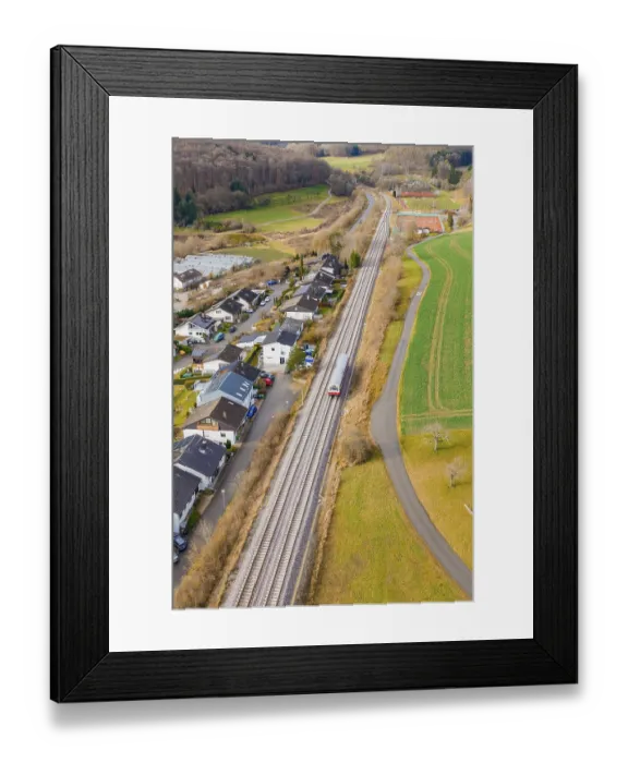 Framed Print : Station on a bend, surrounded by trees and fields near a settlement Framed Print : Station on a bend, surrounded by trees and fields near a settlement