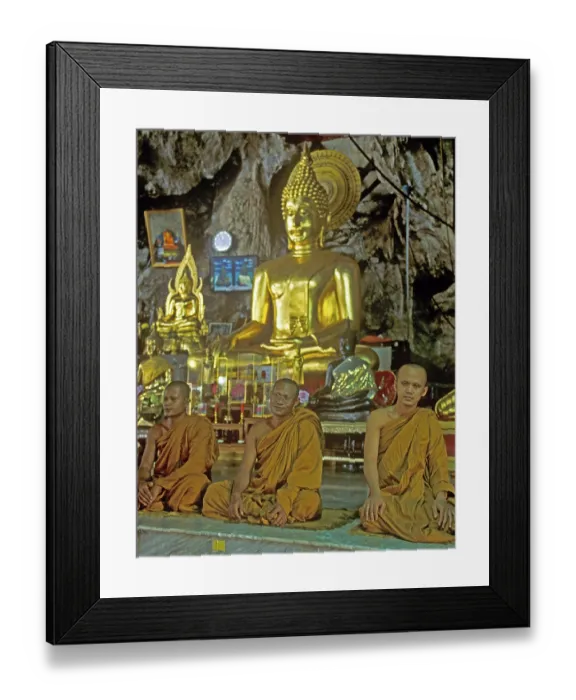 Framed Print : Buddha statue, monks praying, Wat Tam Sua monastery near Krabi