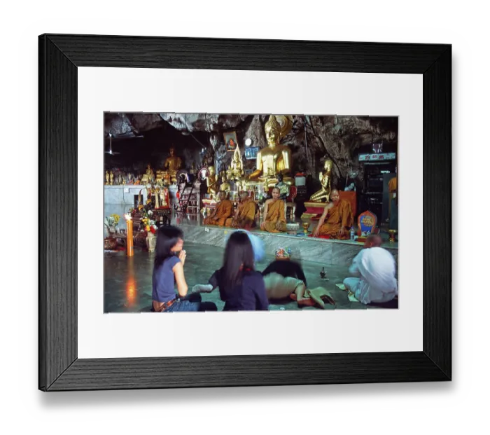 Framed Print : Buddha statue, monks and believers praying