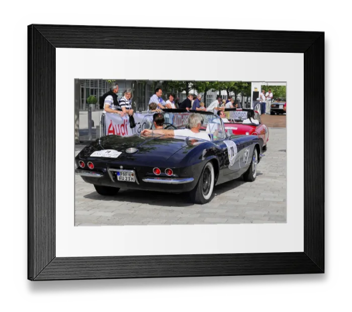 Framed Print : Corvette C 1, black convertible on the road at a classic car event with several participants
