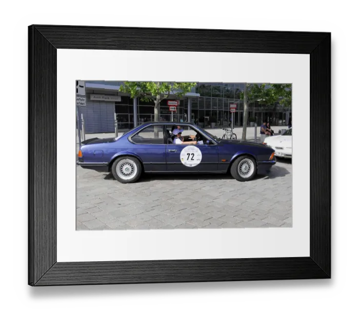 Framed Print : BMW M 635 CSi, classic blue car with driver on a paved city scene