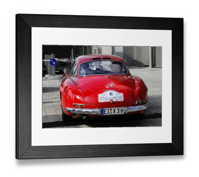 Framed Print : Red Mercedes classic car with Donau Classic 2011 license plate in urban area