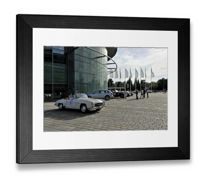 Framed Print : Open space in front of a modern building with a parked vintage car Framed Print : Open space in front of a modern building with a parked vintage car