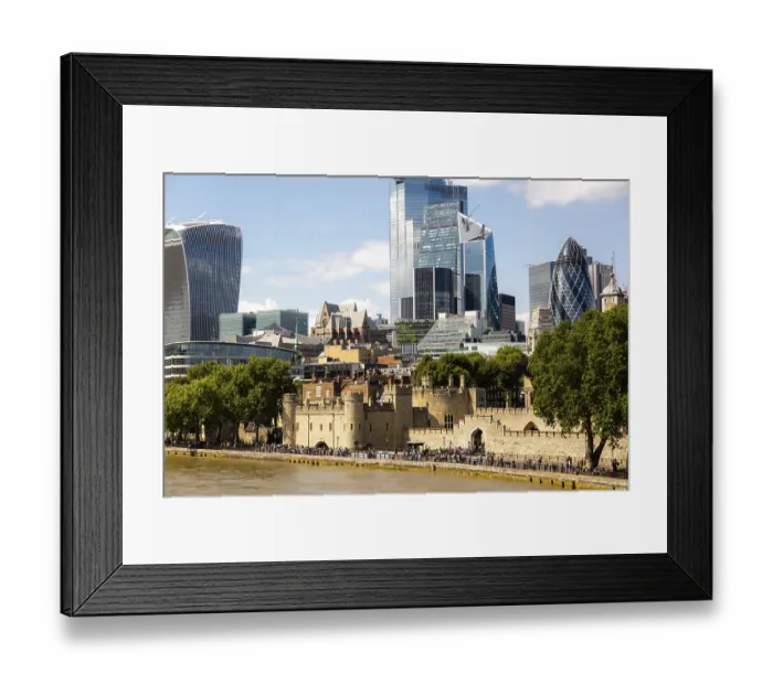 Framed Print : A view of London's skyline with modern skyscrapers and the historic Tower of London along the river in London
