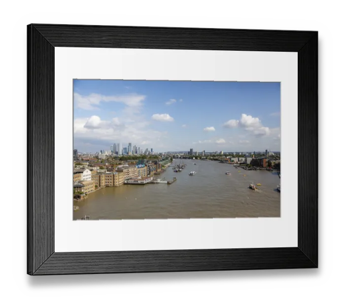 Framed Print : Thames River with visible boats and surrounding London architecture under a bright sky in London