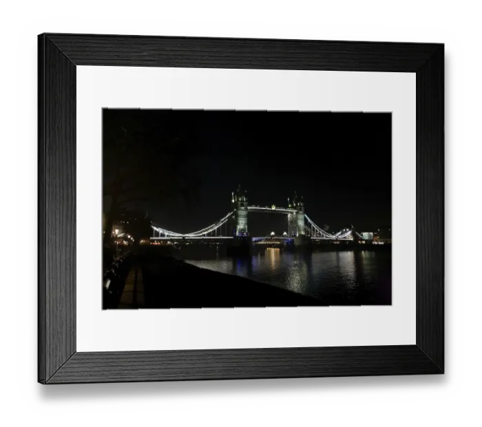 Framed Print : Illuminated Tower Bridge over a calm River Thames at night